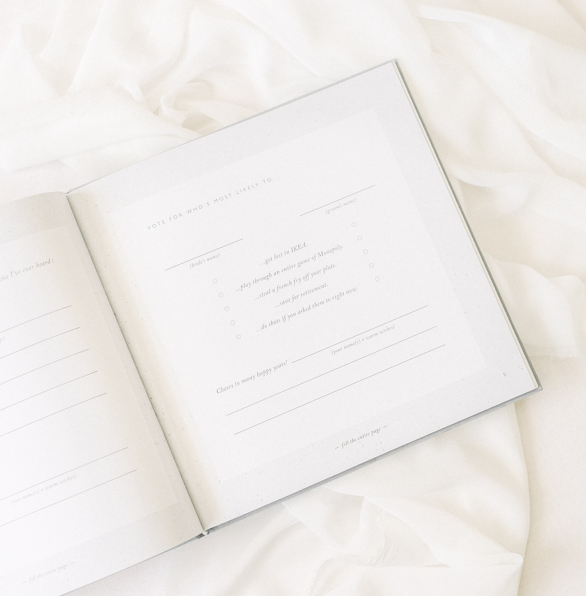 Open pages showing the prompts of the Mr. and Mrs. Book guest book alternative for weddings